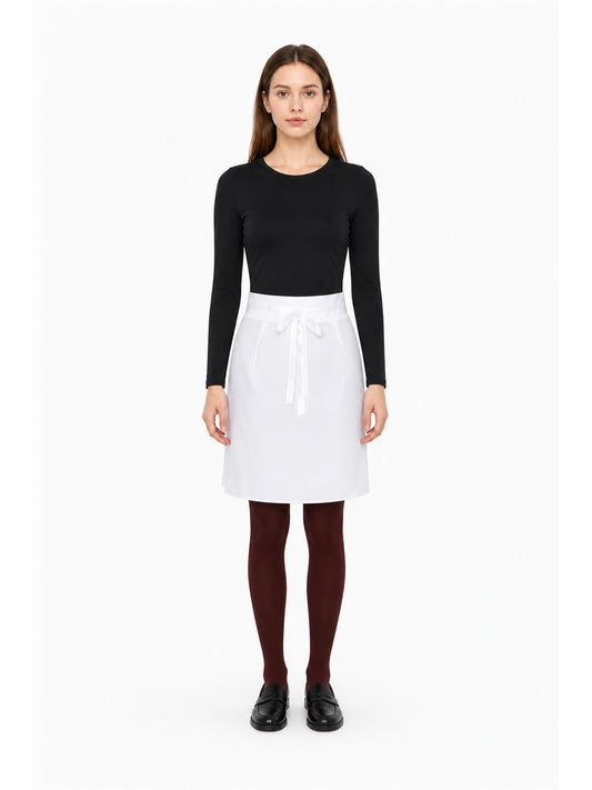 Model wearing the Rin Nohara cosplay set: black long-sleeve bodysuit and white skirt with front ribbon ties, front view