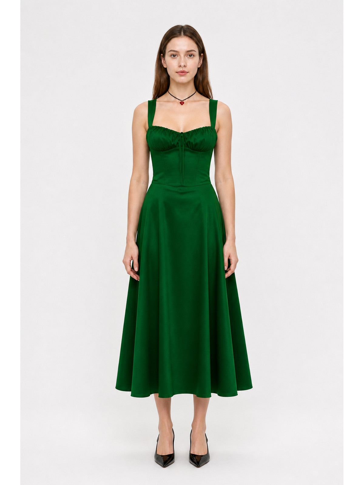 Green dress with thin straps and a square neckline