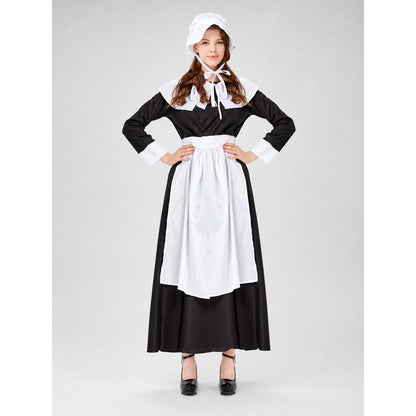 The uniform costume is designed in a black-and-white color scheme and combines elements of a classic maid outfit with a stage costume format. The model creates a complete look with a black top and skirt, long sleeves, white cuffs, a wide wh