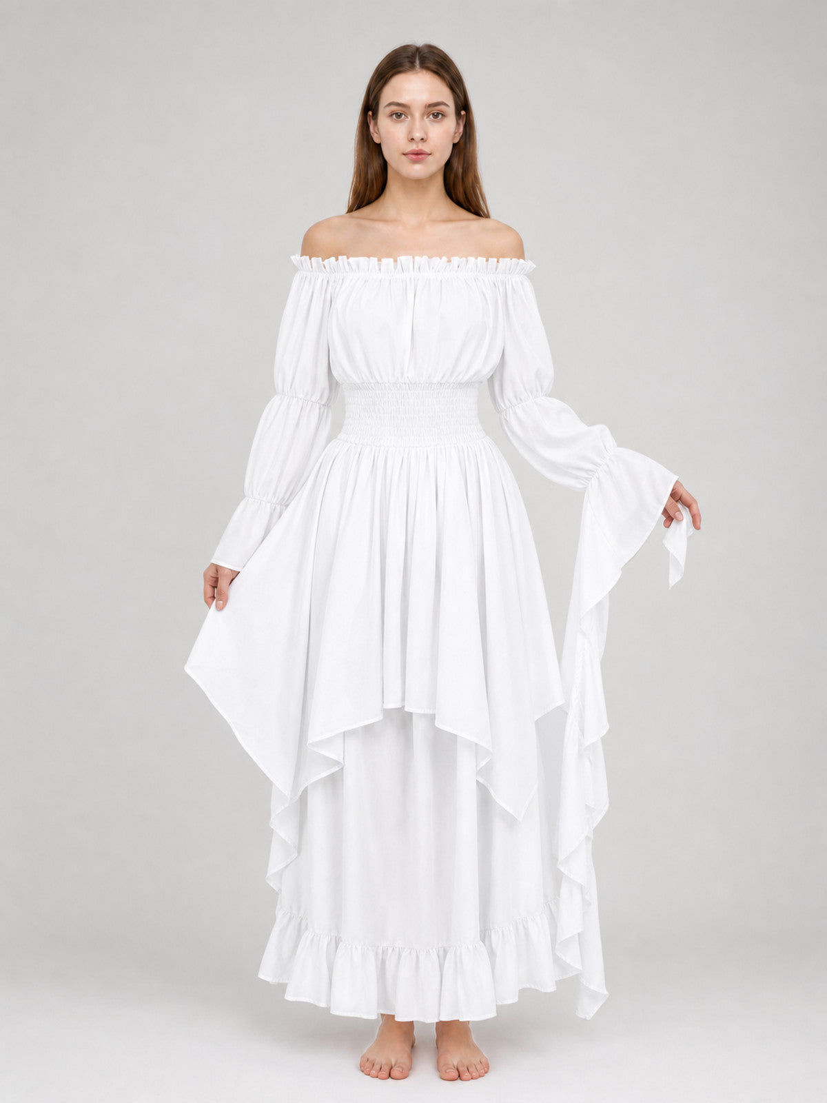White gathered maxi dress on a full-body model, with an off-shoulder neckline, long flared sleeves, layered skirt, and ruffled hem