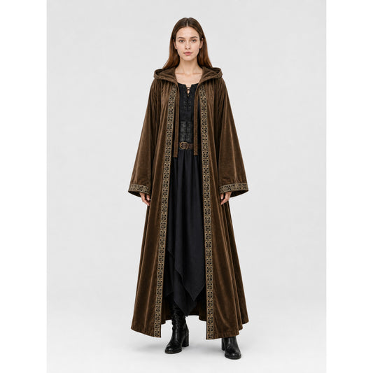 Brown velvet-look hooded cloak on a full-body model, with wide sleeves, patterned front trim, and a long open front