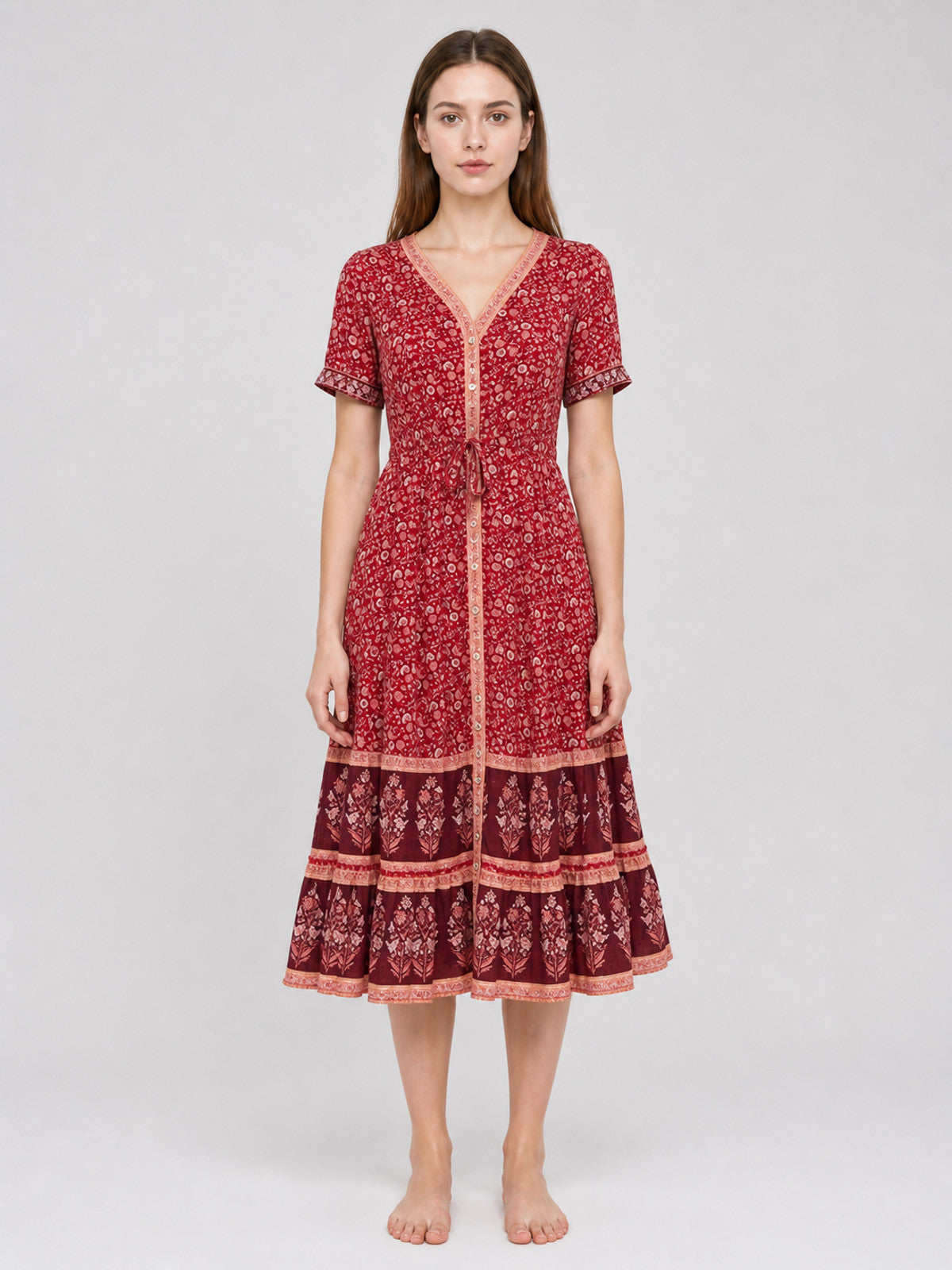 Midi dress with a floral print and tiered skirt front view