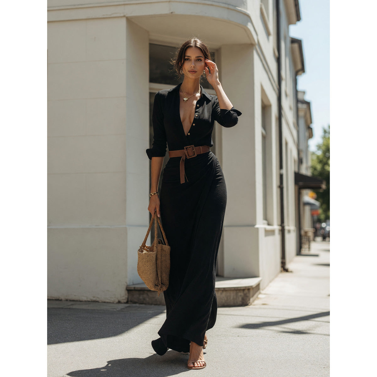 Long black dress with long sleeves and a belt