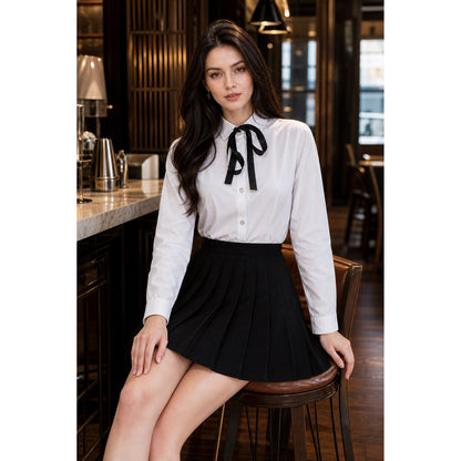Black pleated mini skirt in a school style on-model view