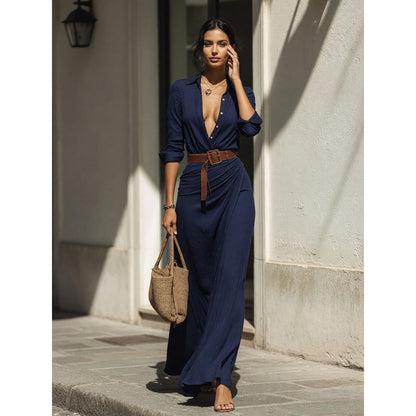 Women's dark navy dress with a belt and long sleeves