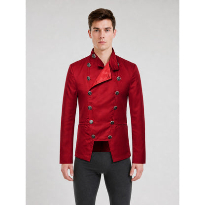 The jacket is presented in a vintage red color and designed in a military style with elements of Gothic aesthetics. The model features a distinctive front construction with a diagonal wrap, giving the garment a bold character. A double row 