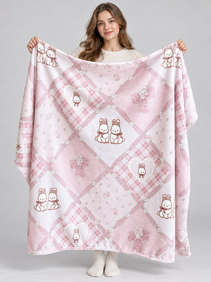 Reversible pink and white blanket with bunnies and bows