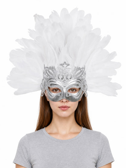 Silver eye mask with white feathers, ornate cutout details, and dangling side loops worn by a woman