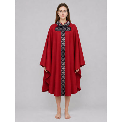 The cape is red with black decorative elements. It has a loose cloak-style silhouette, wide sleeves, and a collar with black patterned detailing. The front features a vertical decorative stripe down the center and a horizontal stripe across