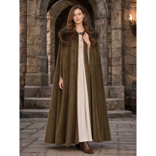 Brown suede-look open-front cape with a wide fur collar and front clasp, shown full-length on a model in a stone archway