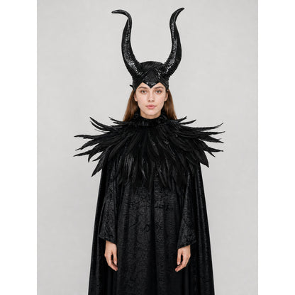 Black horned headpiece and feather-trimmed cape shown full-body on a woman against a plain studio background