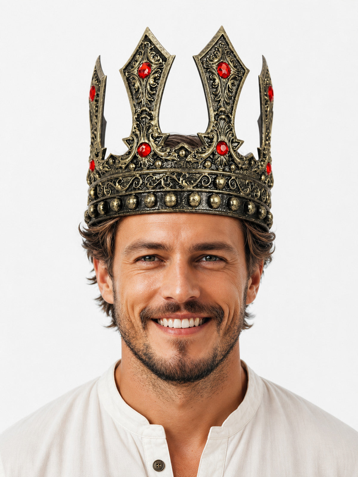 Ornate antique gold crown with red rhinestones and raised decorative points, shown on a front-facing model in close portrait