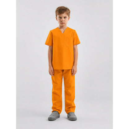 Full-body front view of a child wearing an orange short-sleeve shirt with a chest pocket and matching pants in a studio