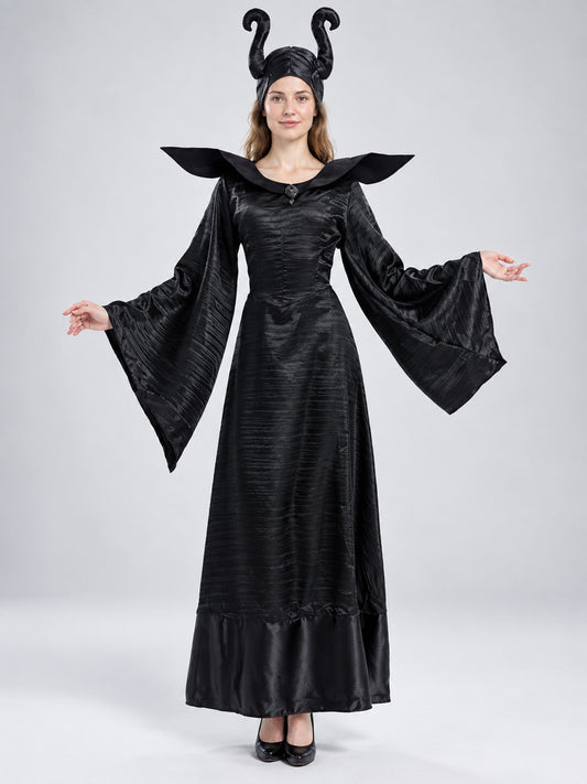 Model wearing a black horned evil queen costume: floor-length dress with wide bell sleeves, pointed stand-up collar and horned headpiece, front view