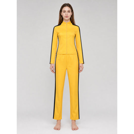 Model wearing the yellow zip-up stand-collar jacket and matching pants with black stripes, front view