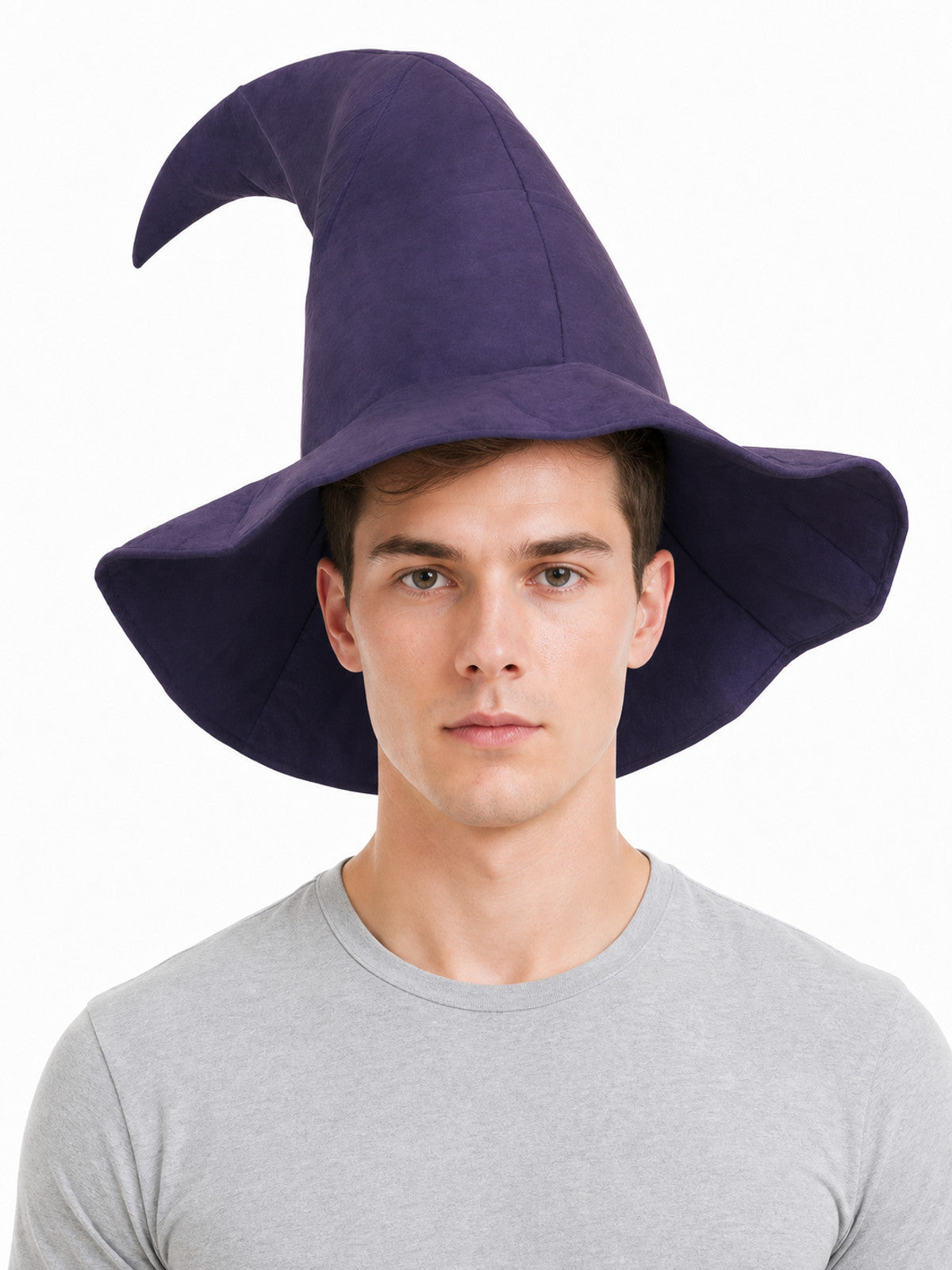 Purple fabric witch hat with a tall bent cone and wide floppy brim, shown on a man against a white background