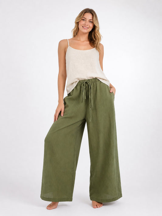 Olive green wide-leg pants on a model, shown full-length with an elastic drawstring waist and side pockets