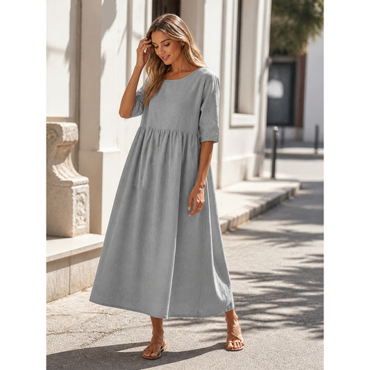Long gray dress with 3/4 sleeves and an A-line silhouette