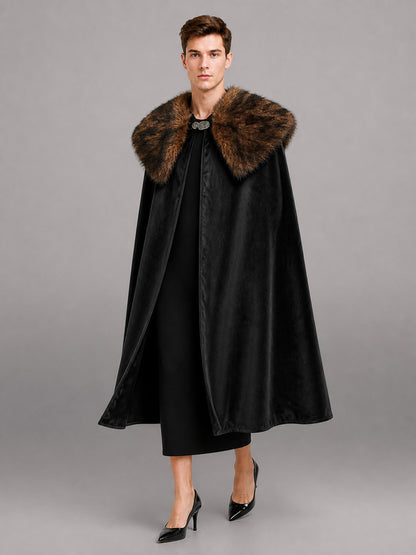 Black velvet-look cape with a wide brown fur collar, shown full-length on a model against a gray studio background