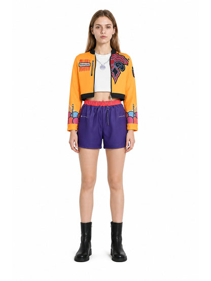 Children's set with an orange jacket and purple shorts