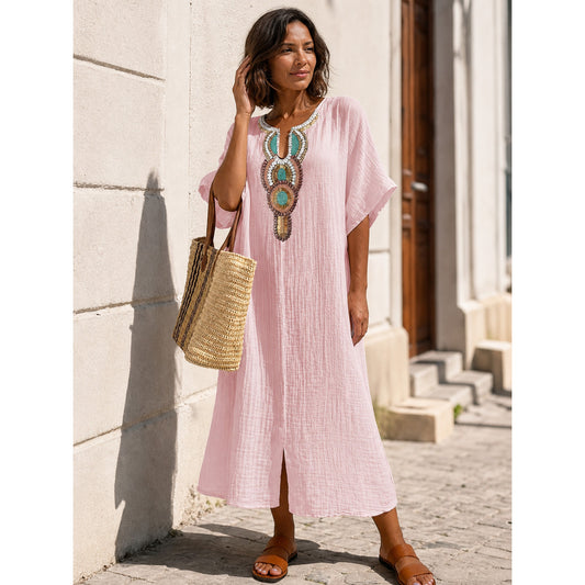 Pink loose-fit midi dress with embroidery and a slit
