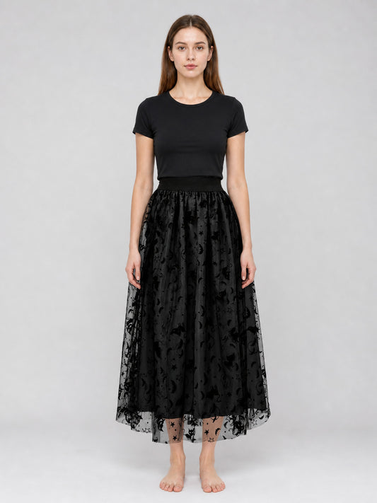 Black mesh midi skirt on a full-body model, with a gathered waistband, layered sheer overlay, and bat motifs along the hem