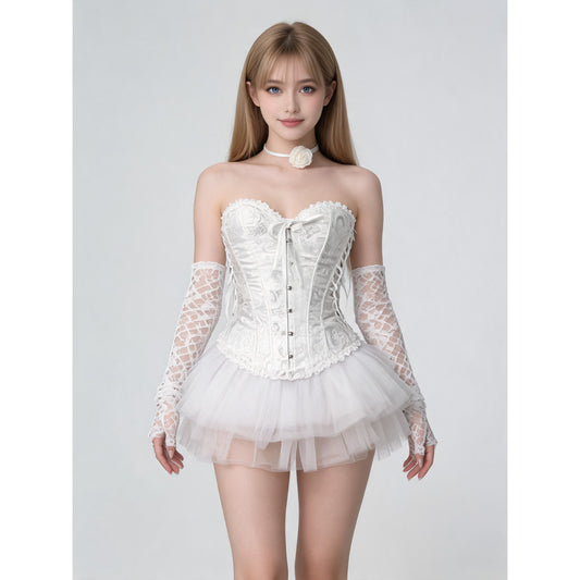 Model wearing a women's white lace-up corset costume with layered tulle tutu skirt, long white lace gloves and rose choker, front view