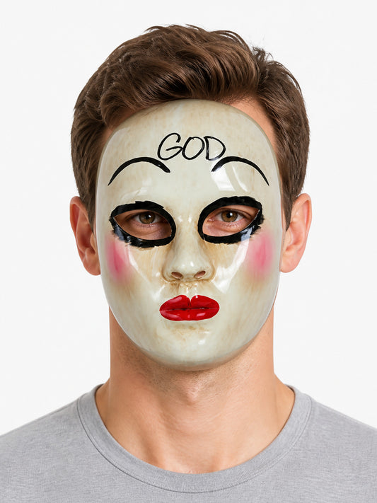 White glossy theatrical face mask shown close-up on a model, with painted black brows, dramatic eye details, pink cheeks, red lips, and forehead lettering