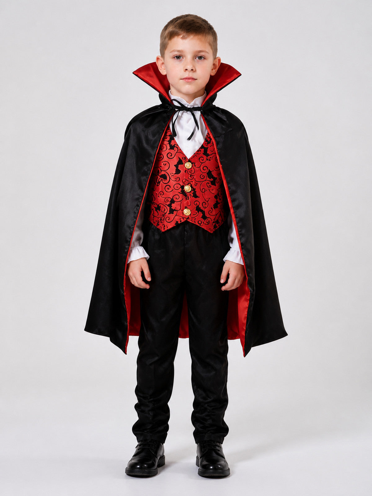 Children's vampire costume with cape, vest, and pants on-model view