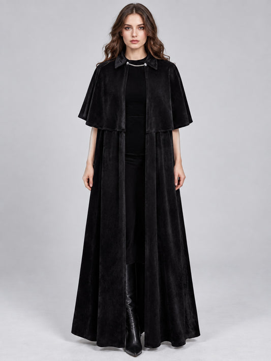 Model wearing a long black velvet vampire cloak with turn-down collar, chain clasp and short shoulder capelet, front view