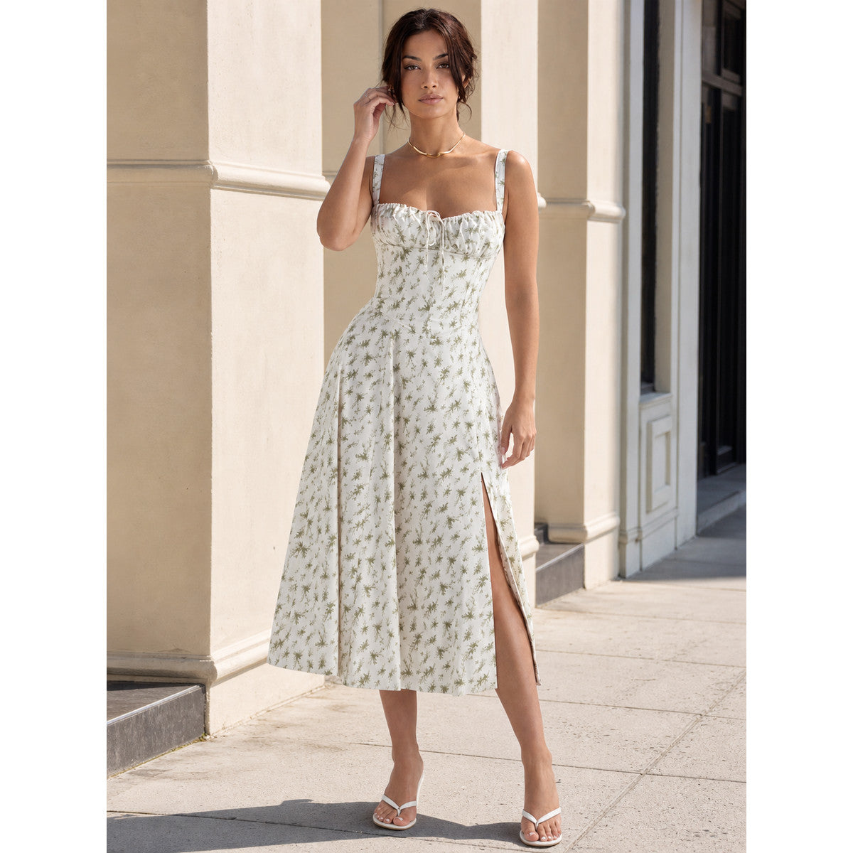 Lightweight midi dress with thin straps, floral print, slit, and fitted silhouette