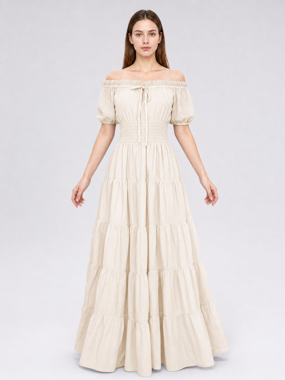 Cream off-shoulder maxi dress with short puff sleeves and multiple gathered tiers, shown full-body on a model
