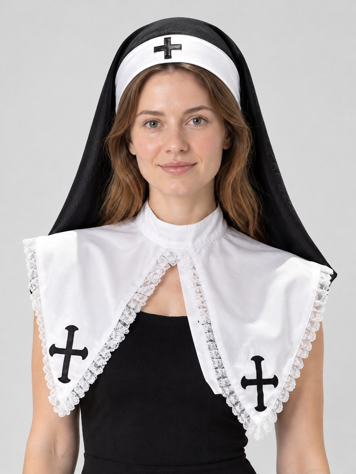 Black and white nun's headpiece with cross and veil