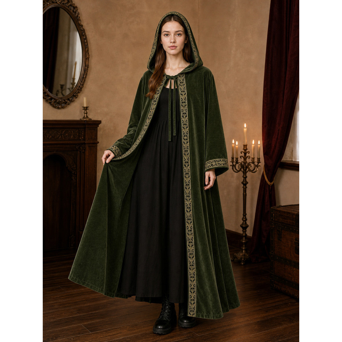 Green velvety hooded cloak on a full-body model, with ornate gold trim and wide sleeves in a candlelit interior