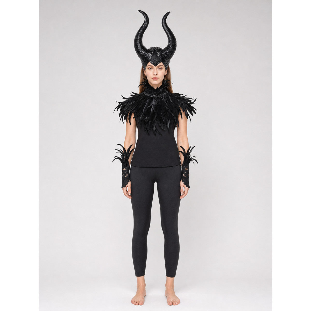 Black horned headpiece with glossy curved horns, shown on a full-body model with a black feather collar and matching wrist pieces