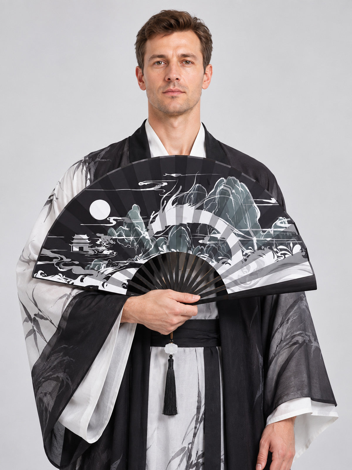 Folding fan with a landscape design and a tassel, black