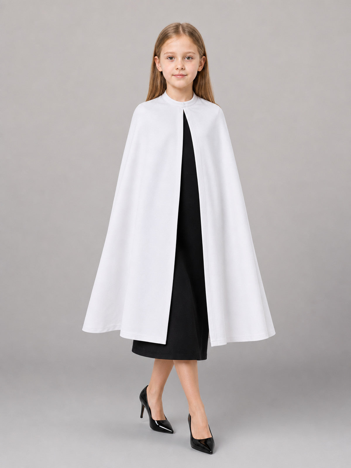 Description: White shoe covers—a pair of accessories for completing a costume front view