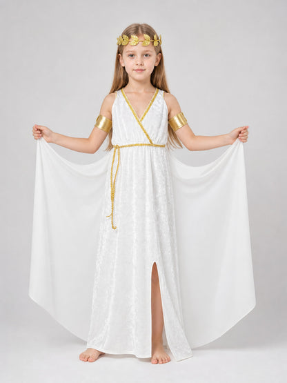 Full-body view of a child wearing a white flowing dress with gold trim, split front, draped sleeves, gold arm bands, and a laurel wreath
