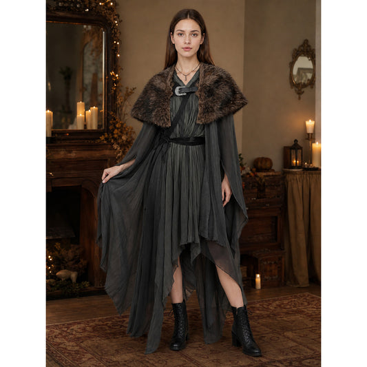 Brown fur-look shoulder shawl with front buckle, shown on a model over a long dark dress in a full-body indoor scene