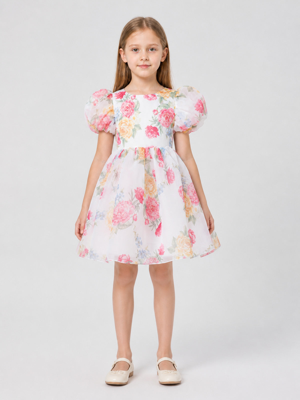 Children's dress with rose print, puff sleeves, and bow on-model view