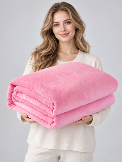 Pink solid-color blanket with a soft fuzzy surface