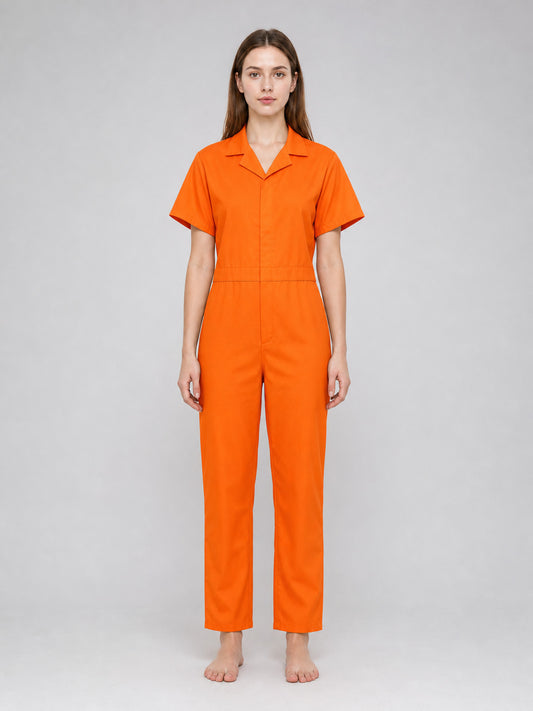 Orange short-sleeve jumpsuit with a collar, shown full-body on a model against a plain gray background