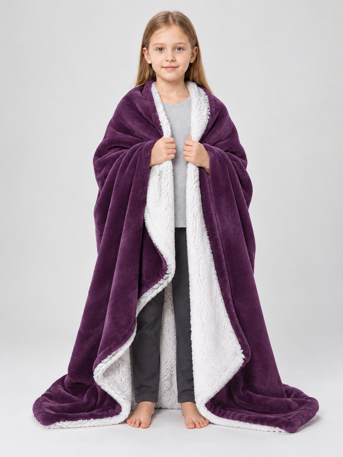 Reversible purple blanket with a white reverse side