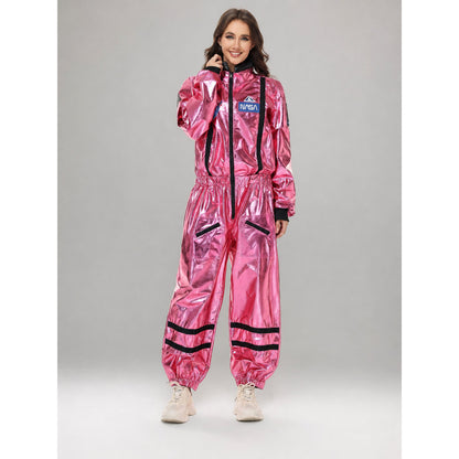 The pink NASA astronaut costume is designed as a one-piece jumpsuit with long sleeves, a stand-up collar, and a central zip closure. The model is pink with black decorative elements: a vertical stripe on the front, zippered side pockets, ho
