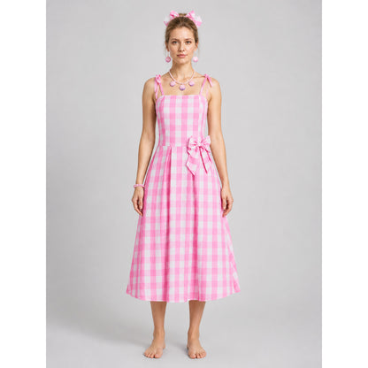 Pink-and-white gingham pinafore dress with a bow on-model view