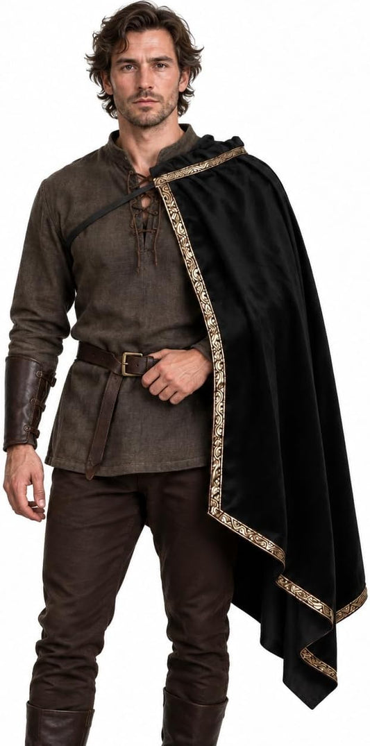 Black medieval half-shoulder cape with gold-tone trim, draped over one shoulder – front view