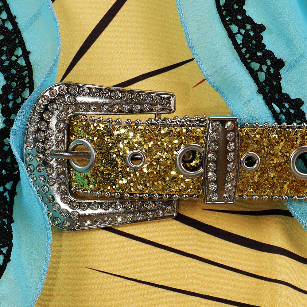 Close-up of the gold glitter belt with silver rhinestone buckle over the blue lace-trimmed cape