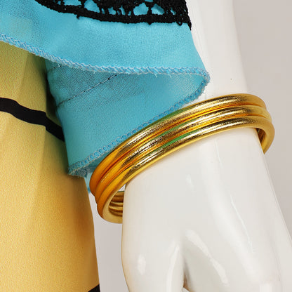 Close-up of the gold bangles and the blue cape hem on the Cleo de Nile costume