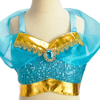 Close-up of the crop top: turquoise sequins, gold metallic V-neckline, gold lace trim and faux-jewel centerpiece
