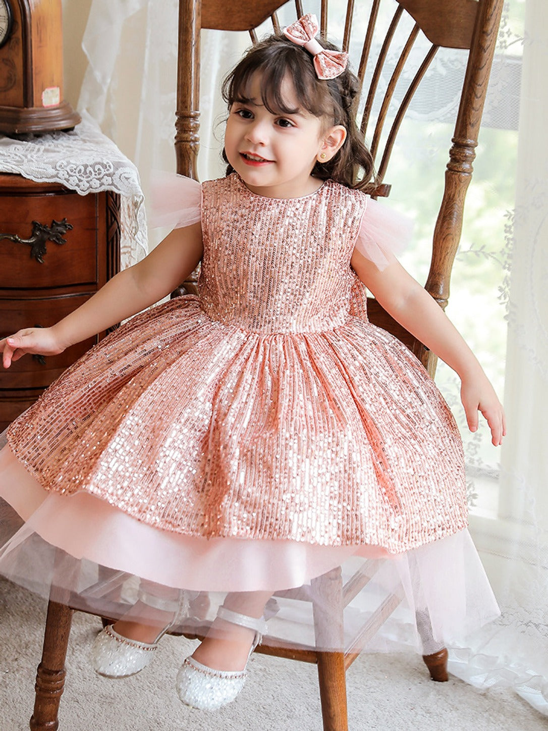 Toddler wearing the pink sequin tulle dress, real photo showing sequin texture and tulle hem